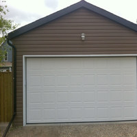 New garage with vinyl siding New garage with vinyl siding